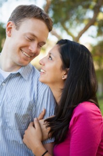 Couple embracing in park