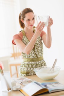 Woman cooking in kitchen.