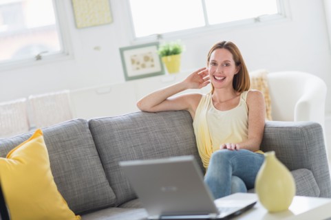 Woman using laptop at home.