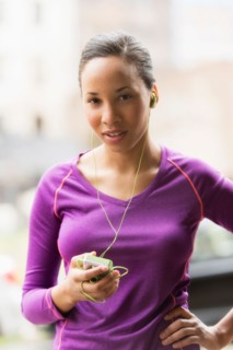 Portrait of female jogger with mp3 player.