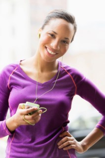 Portrait of female jogger with mp3 player.