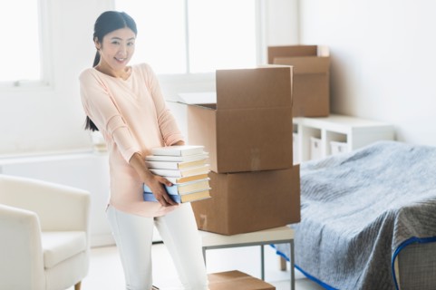 Woman moving home.
