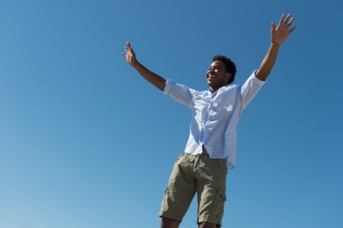 Happy man against clear sky.