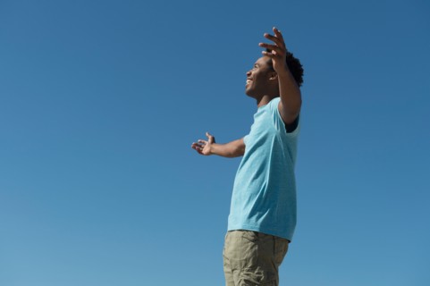 Happy man against clear sky.