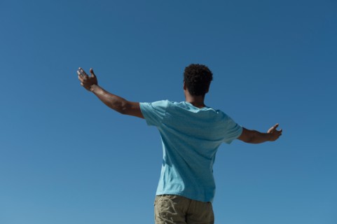 Happy man against clear sky.