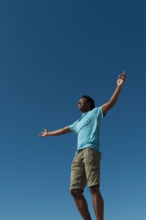 Happy man against clear sky.