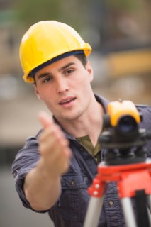 Engineer using theodolite.