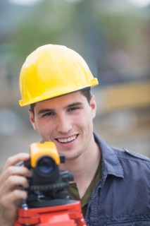 Engineer using theodolite.