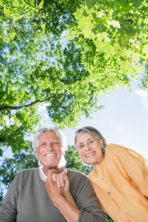 Central Park, New York City. Senior couple under trees.