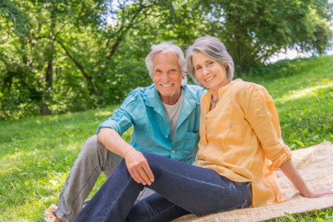 Central Park, New York City. Senior couple relaxing in park.