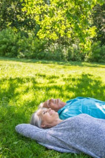 Central Park, New York City. Senior couple relaxing in park.