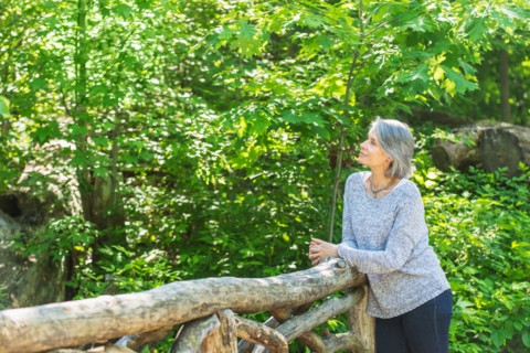 Central Park, New York City. Senior woman relaxing in park.