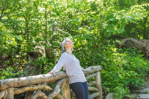 Central Park, New York City. Senior woman relaxing in park.