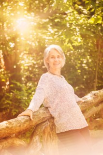 Senior woman relaxing in park.