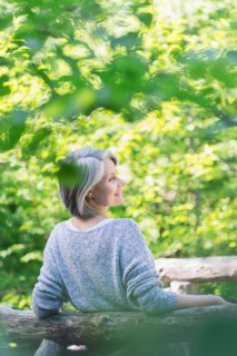 Central Park, New York City. Senior woman relaxing in park.