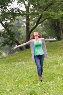 Central Park, New York City. Woman relaxing in park.