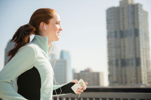 Teenage girl (14-15) jogging in city