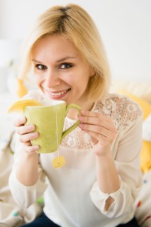 Young woman drinking tea