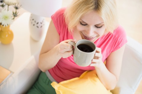 Young woman drinking coffee