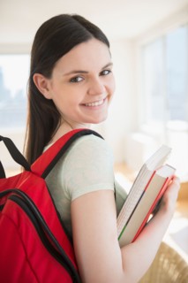 College student with books and backpack
