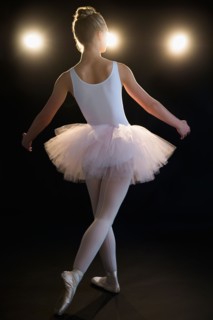 Rear view of teenage (16-17) ballerina on stage