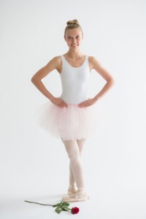 Teenage (16-17) ballet dancer with red rose