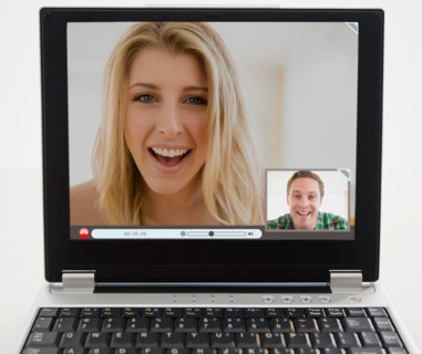 Man and woman chatting on computer