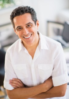 Portrait of cheerful photographer