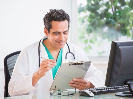Portrait of doctor working in office