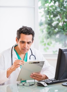 Portrait of doctor working in office