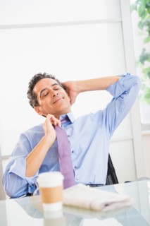 View of mature man relaxing in office