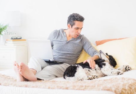 View of mature man using laptop at home