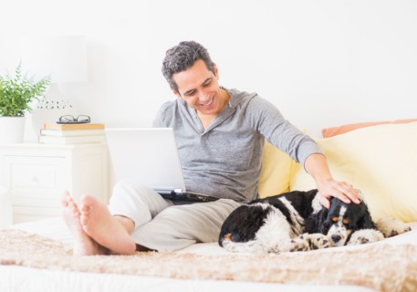 View of mature man using laptop at home