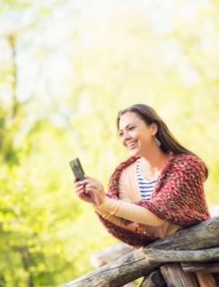Mid adult woman using mobile phone