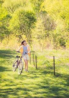 Mid adult woman with bicycle