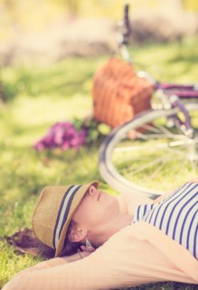 Portrait of mid adult woman relaxing in park
