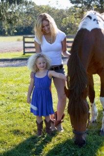 Mother with daughter (4-5) outdoors