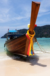 Traditional boat moored on beach