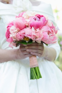 Bride with bouquet of pink flowers