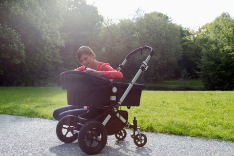 Mother with pram in park