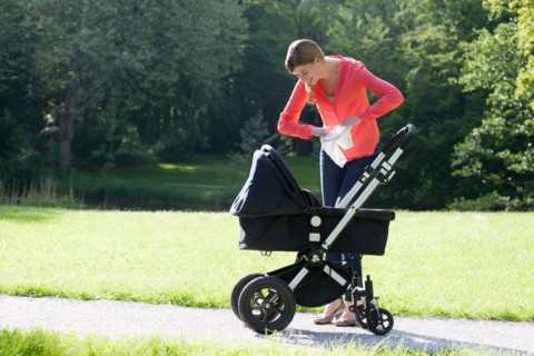 Mother with pram in park