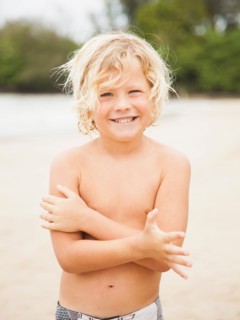 Portrait of boy (6-7) on beach
