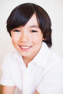 Portrait of boy (8-9) in white shirt