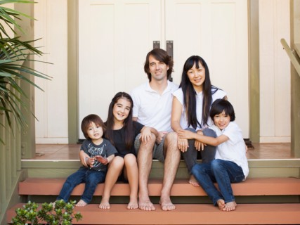 Portrait of family with three kids (2-3, 8-9)