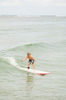 Boy (6-7) surfing