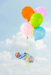 Newborn baby delivered by balloons.