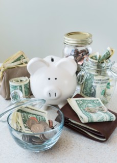 Studio shot of savings in jars.