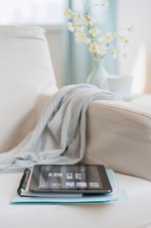 Tablet pc on armchair.