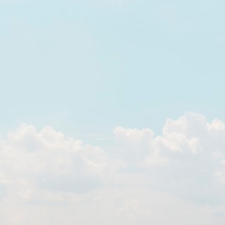 Sky with puffy clouds.
