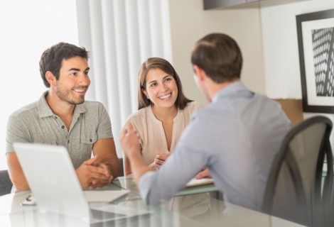 Customers talking to advisor in office.